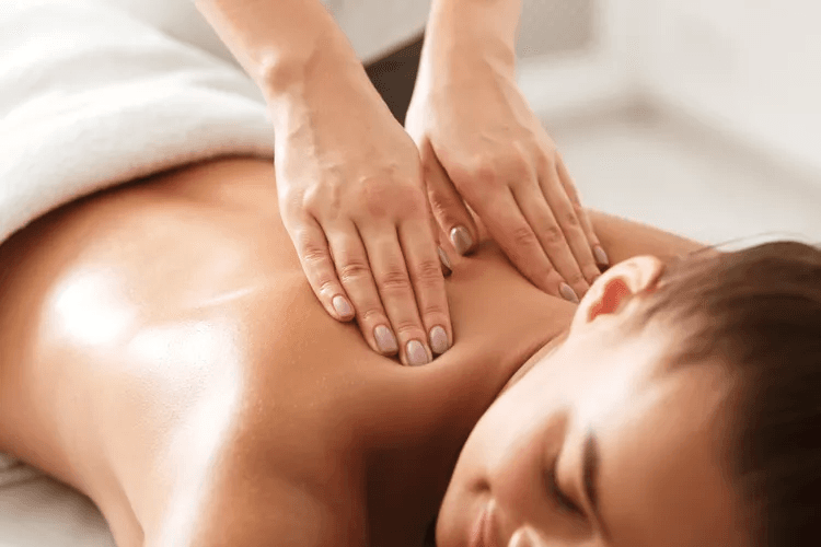 Therapist performing traditional Thai massage with rhythmic compression techniques